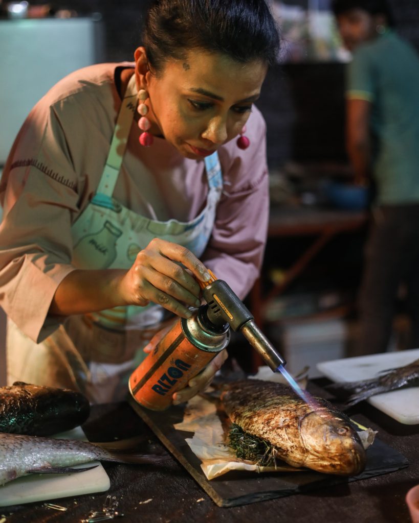 Food stylist Payal  with foodstyling tool ,a blowtorch.